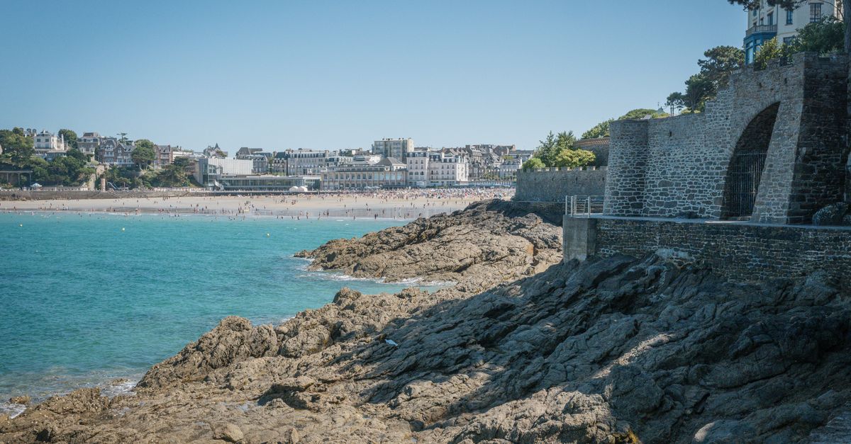 Sunny beach on the French Atlantic coast in summer 2026 with holidaymakers
