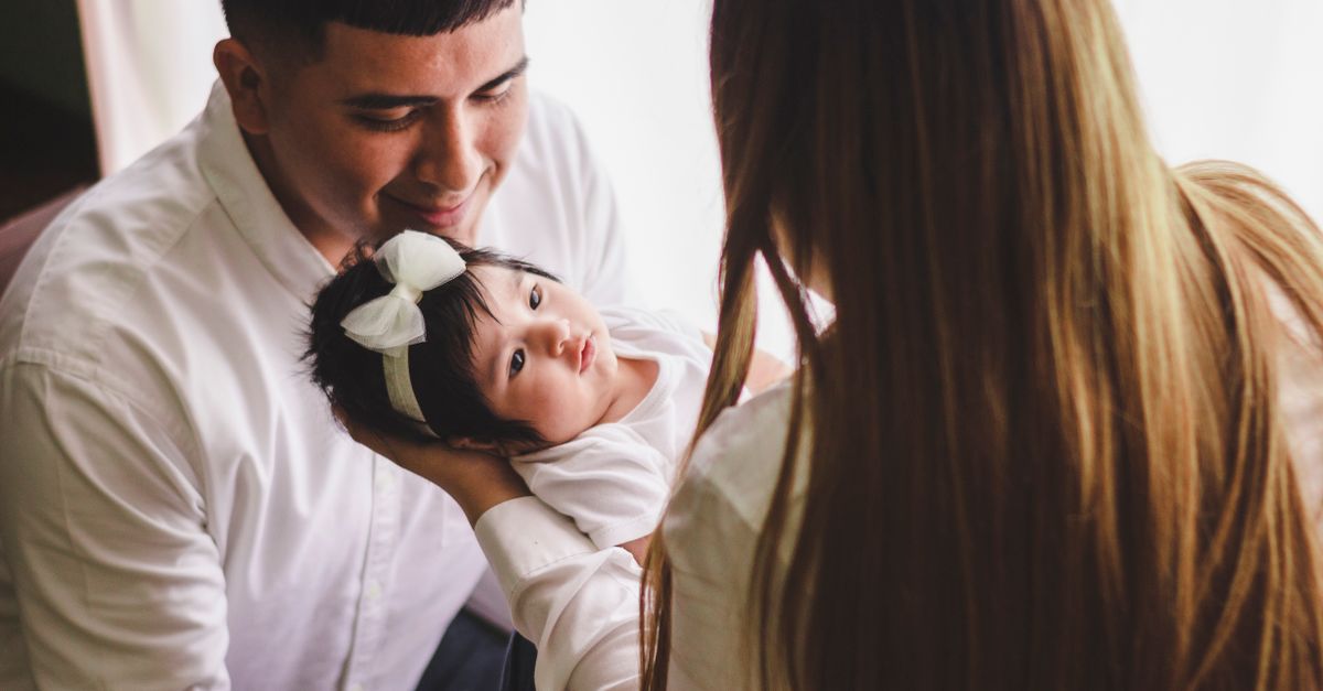 Young parents holding their newborn baby, symbolising the new 2026 birth leave