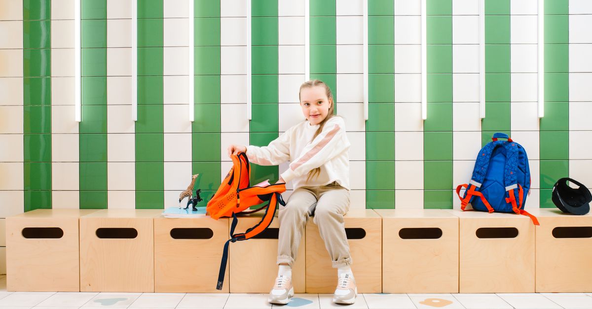 School supplies and a school bag on a desk for the 2026 back-to-school season