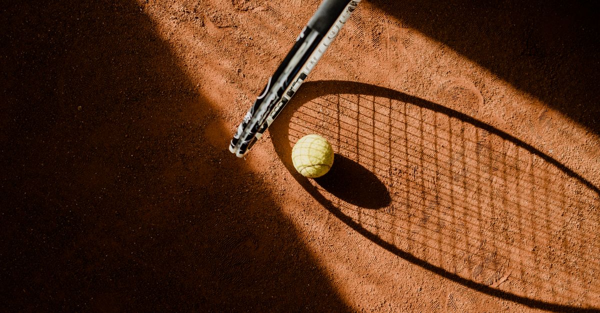Tennis player on clay court at Court Philippe-Chatrier Roland-Garros Paris